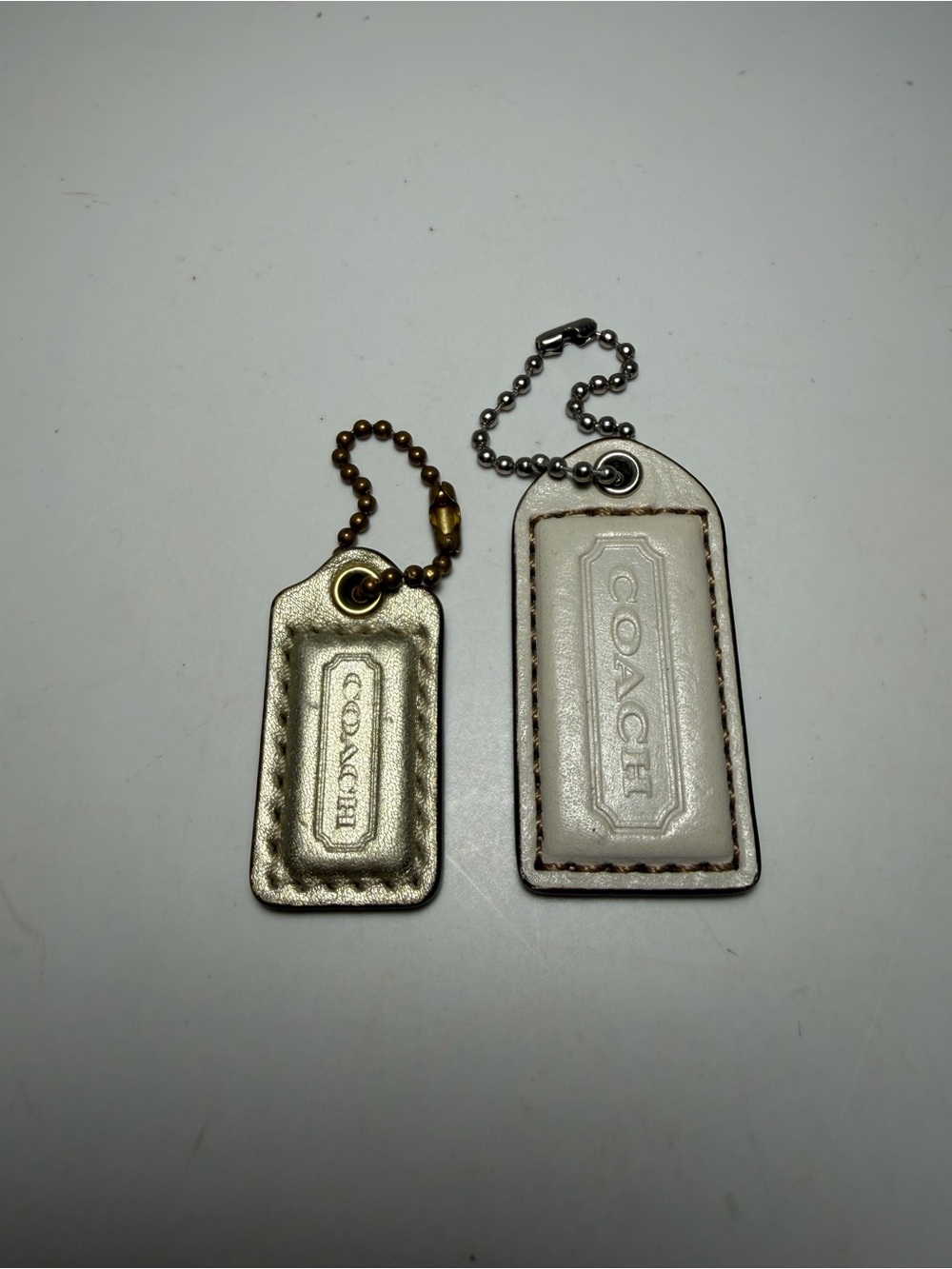 Coach Leather Tag Keychain Duo in Metallic Gold and White